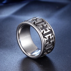 Men's retro stainless steel ring with embossed cross patterns on blue satin background
