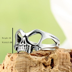 Retro stainless steel skull ring for men with polished silver finish on tree bark
