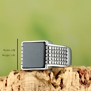 Retro stainless steel men's ring featuring a square black gemstone and relief textures
