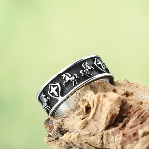 Vintage stainless steel ring featuring relief Pegasus and cross shield on wooden bark