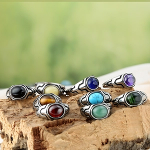 Vintage stainless steel rings for men with oval gemstones in various colors and floral carvings