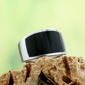 Punk style stainless steel wide band ring with black enamel inlay on natural wood stand