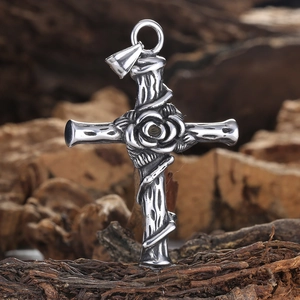Vintage stainless steel cross necklace with a central rose and detailed vine textures