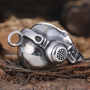 Detailed close-up of a skull pendant with headphones on a dark wood background