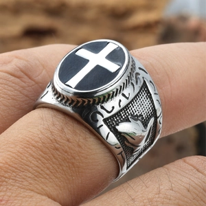 Vintage stainless steel cross ring with embossed praying hands and punk aesthetic