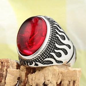 Vintage punk men's ring featuring large red gemstone and silver flame pattern
