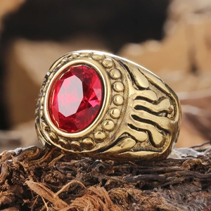 Vintage gold stainless steel men's ring with large oval ruby and embossed detailing