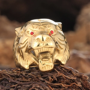 Gold tiger head ring for men with ruby red eyes and intricate punk style engraving