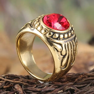Retro punk titanium steel ring with a large red gemstone and vintage gold floral carvings