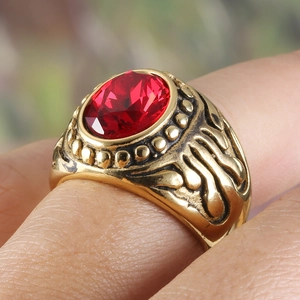 Vintage gold stainless steel men's ring with large oval red gemstone and relief carving