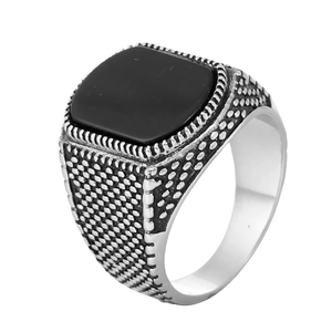 Vintage silver signet ring for men featuring a square black stone and textured metal band