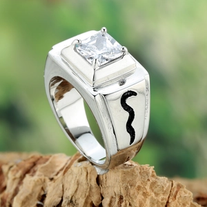 Men's silver ring with square-cut zircon and black wavy pattern on wood background
