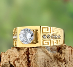 Macro view of gold titanium ring for men with large zircon and Greek Key patterns
