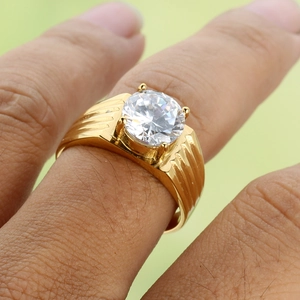 Golden titanium steel ring with wavy texture and round zircon stone on finger