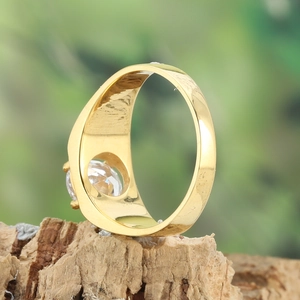 Elegant gold titanium steel ring with sparkling round zircon on a natural bark base