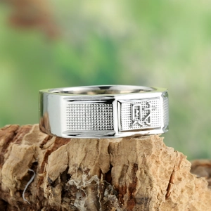 Silver mens square ring with embossed Chinese Wealth character on textured metal band