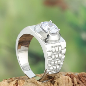 Macro detail of men's titanium ring with brick texture and claw-set round zircon stone