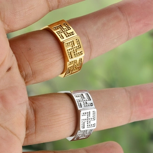 Retro stainless steel rings in gold and silver with embossed swastika pattern