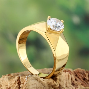 Macro shot of men's gold titanium ring with a large round-cut cubic zirconia stone