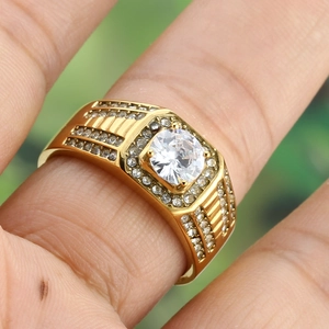 Men's wide gold plated wedding ring with a large zircon center stone and side pave accents