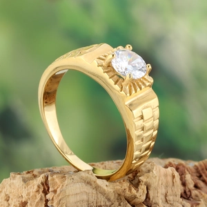 Gold stainless steel ring with white gemstone and strap texture on nature wood
