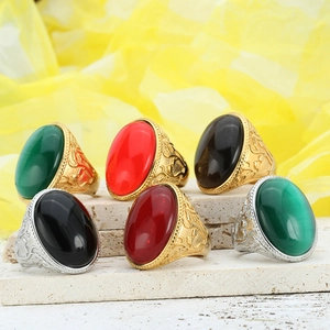 Classic vintage rings set with colorful gemstone oval cabochons and embossed metal bands