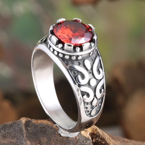 Retro stainless steel ring with a faceted red stone and gothic floral engraving