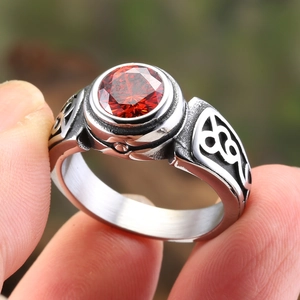 Vintage steel ring for men with large red gemstone and celtic knot carvings