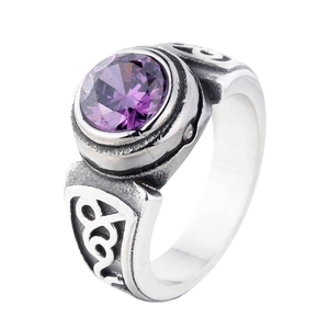 Vintage silver-tone ring with large round purple faceted gemstone and engraved scroll patterns