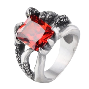 Punk style dragon claw ring in vintage steel featuring a large square red gemstone
