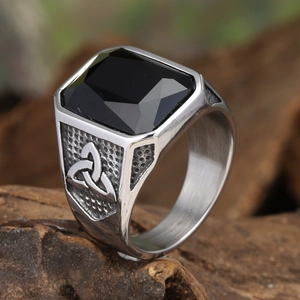 Macro view of vintage Viking ring featuring black onyx gemstone and Celtic knot design