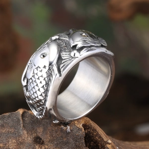 Macro detail of retro koi fish carving on wide stainless steel ring with micro rhinestones