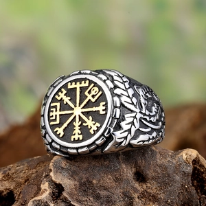 Macro shot of Viking Vegvisir ring with vintage compass and engraved feather texture