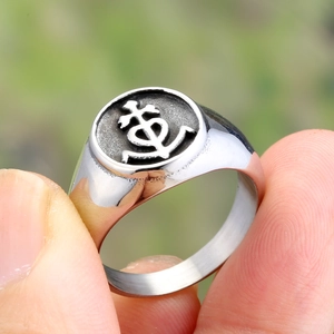 Close-up of vintage anchor and cross emblem ring in silver finish for men