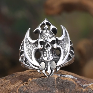 Macro shot of gothic skull and double-axe engraved ring with vintage silver finish