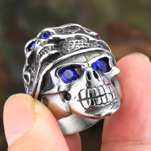 Retro titanium steel skull ring with blue sapphire stones in a gothic punk style