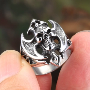 Vintage silver skull ring with gothic axe motifs and antique finish on stainless steel