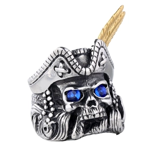 Punk pirate skull ring in stainless steel with blue gem eyes and golden feather detail