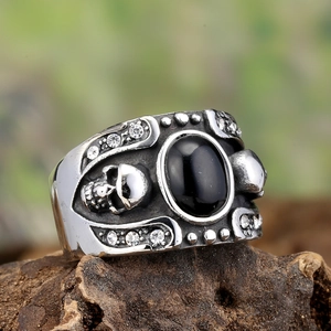 Vintage gothic men's steel ring with black gemstone and silver skull relief details