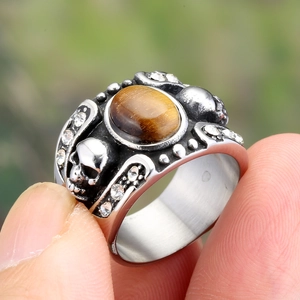 Vintage men's titanium steel ring with tiger eye stone and dual skull carvings