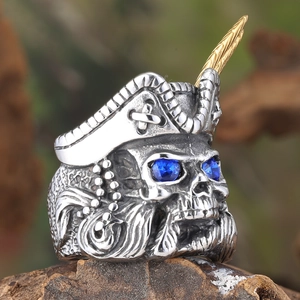 Vintage stainless steel pirate skull ring with gold feather and blue crystal eyes
