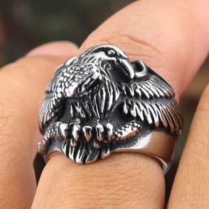Macro detail of men's vintage titanium steel eagle ring with antique silver finish