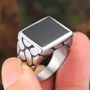 Retro silver mens ring with black rectangle stone and textured pebble pattern band