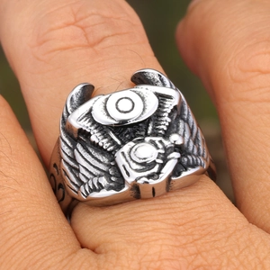 Punk style stainless steel engine ring with wing reliefs and vintage black finish