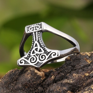 Vintage Thor's Hammer Viking ring with Celtic knots in aged silver finish on a dark rock