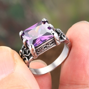 Vintage stainless steel ring featuring a large purple rectangular gemstone and gothic carving