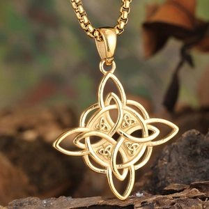 Golden Celtic knot pendant on box chain displayed on natural wood bark background