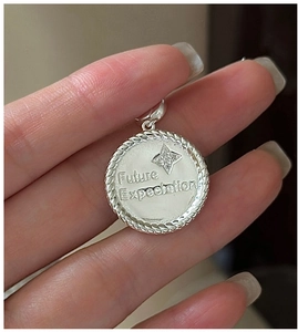 Close-up of S925 silver star pendant with Future Expectation engraving and rope edge