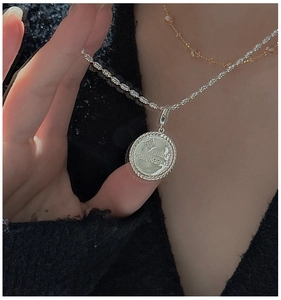 Macro detail of S925 sterling silver star pendant necklace with Future Expectation text