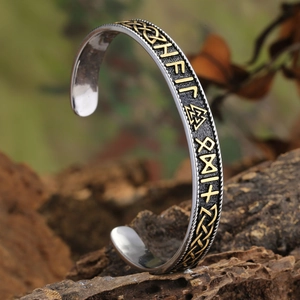 Viking Thor Hammer open bangle with gold runes and Celtic knots on bark background